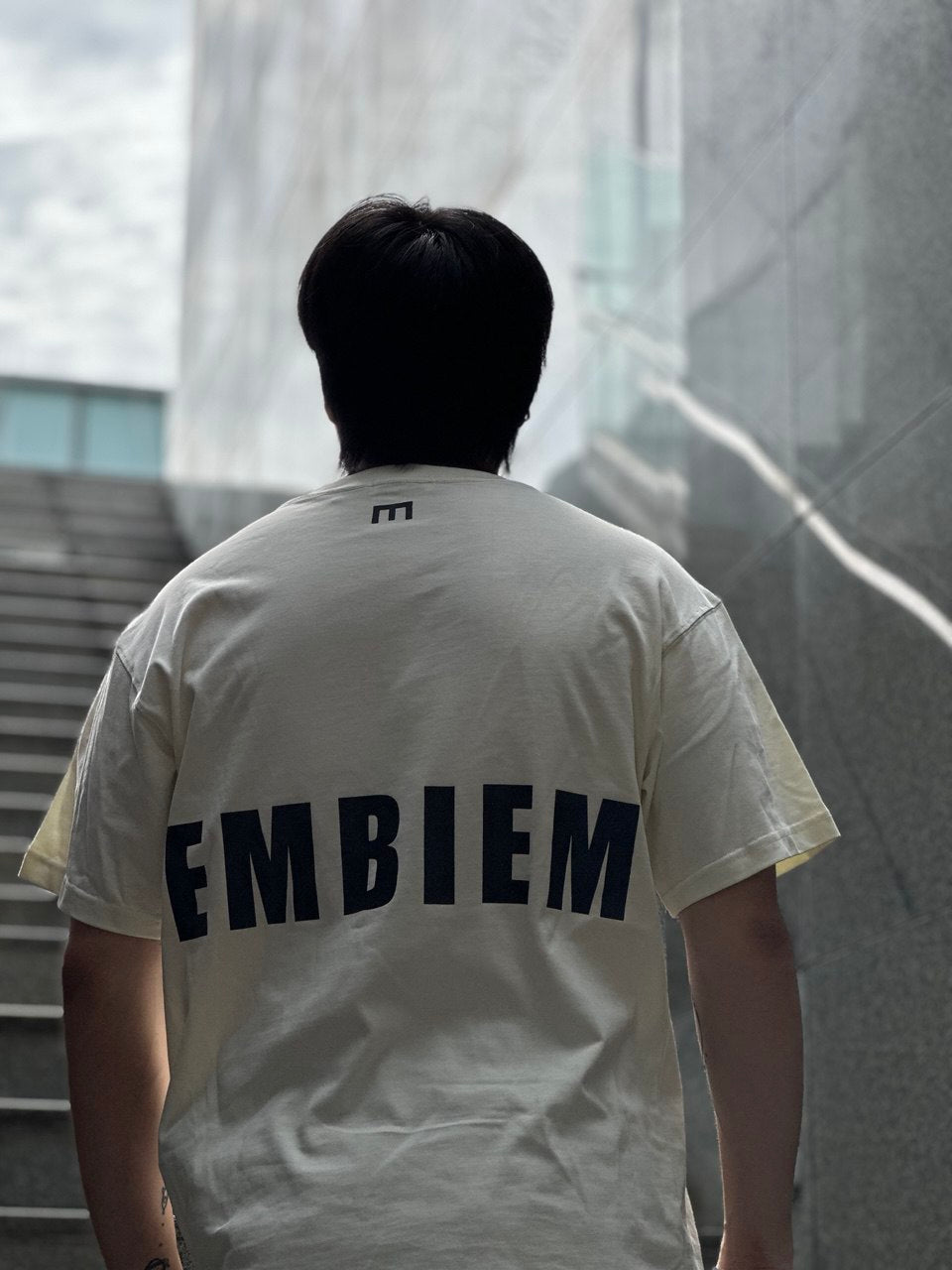 Embiem T shirt cream model back view